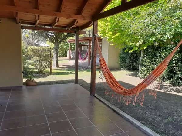 Cabaña Nro4 exterior cochera y hamaca paraguaya